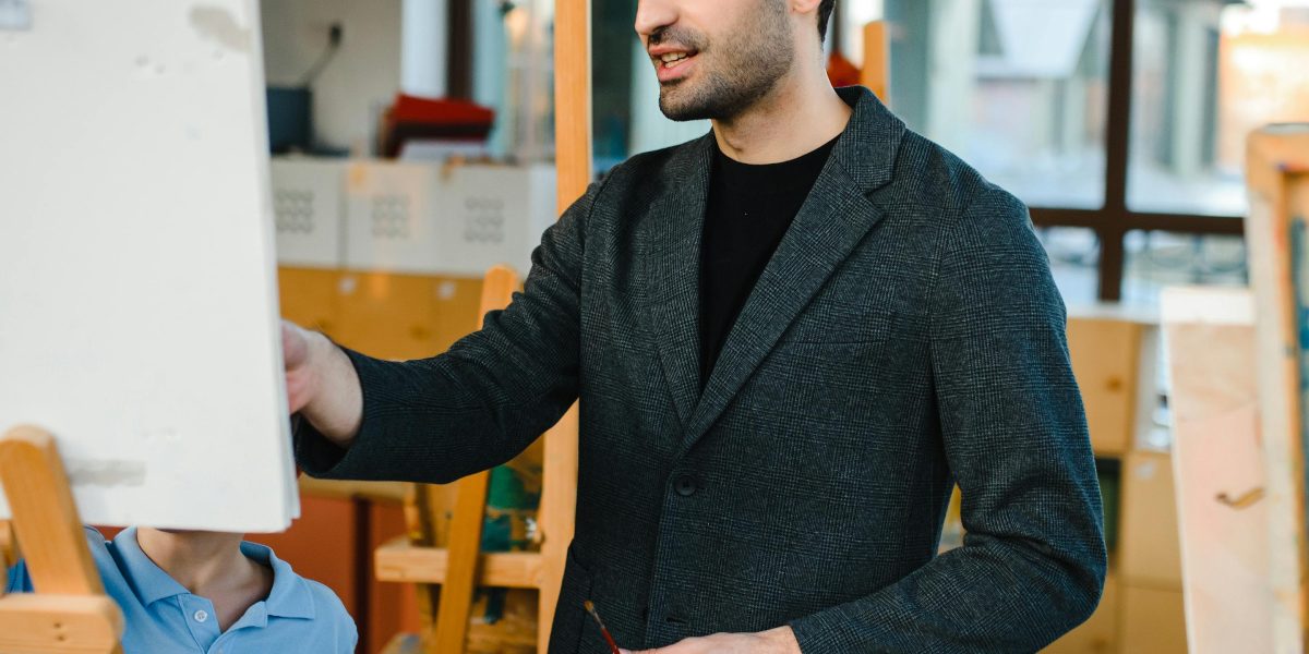 An experienced individual offering guidance and support to a younger person, symbolizing mentorship and legacy.