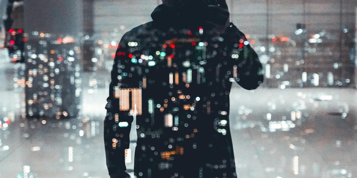 A person observing a complex, possibly futuristic, cityscape with a sense of contemplation.