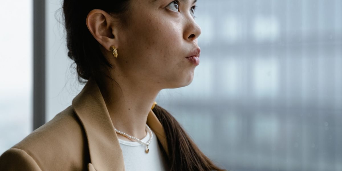 A person lost in thought, possibly contemplating the implications of a dystopian future.