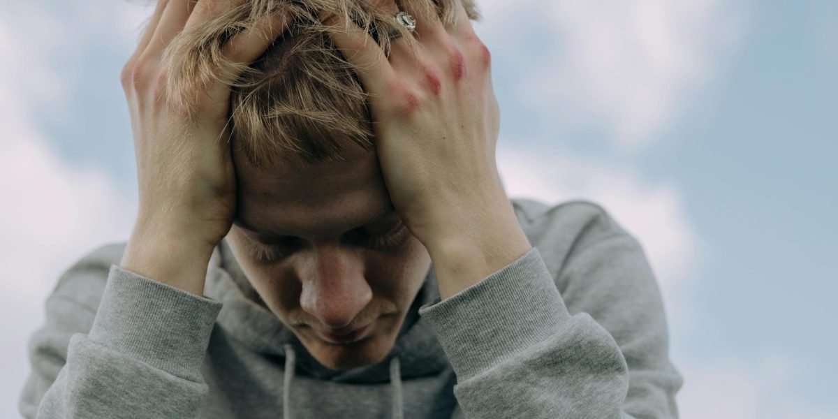 A person feeling overwhelmed by the sheer volume of streaming options, seeking guidance.