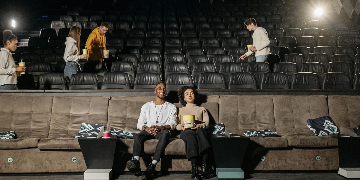 Friends or family enjoying a movie together, reflecting the joy of successful content discovery.