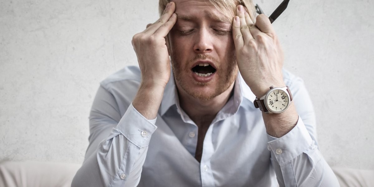 A person expresses frustration or thoughtful confusion while trying to navigate many options to find something specific.